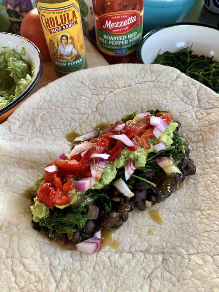 Burritos with rehydrated dried spinach are a healthy option for lunch while camping.