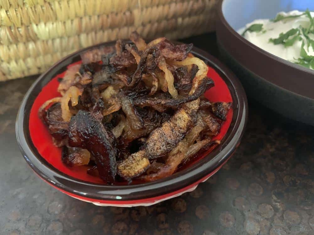 These perfectly deeply caramelized onions are ready top a dish of instant pot mujadara!