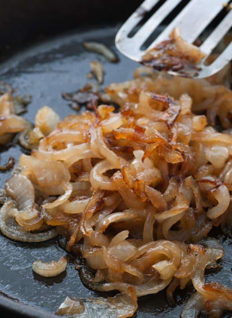 Golden caramelized onions in a pan.