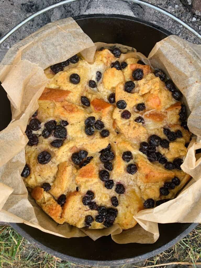 Dutch oven blueberry bread pudding is my families' favorite sweet breakfast on car camping trips.