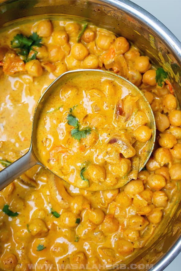 Creamy coconut chickpea curry is a fast and delicious canned food dinner when camping.
