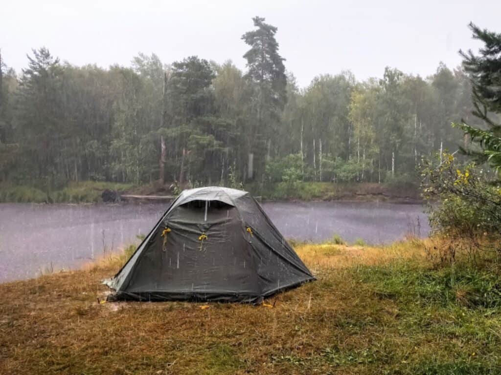 If it rains, having a weather-proof tent and a tarp can make or break your trip.
