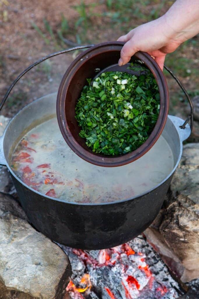 Preparing s camping soup over the fire is a satisfying and rewarding experience for all!