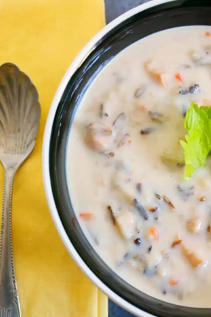 A creamy chicken and rice soup sure hits the spot on a cold night of camping!