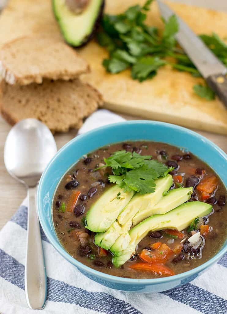 Black bean soup is an ideal vegan camping soup choice for a cozy night by the fire.