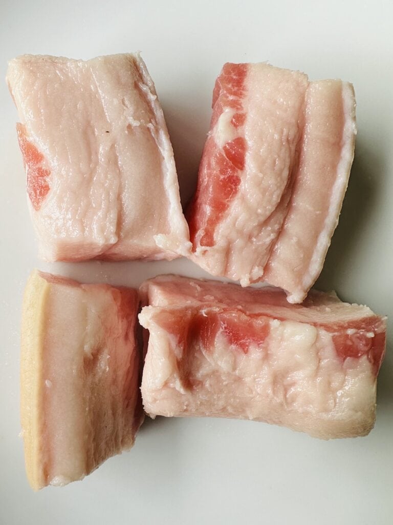 Chop the salt pork into quarters and then slice a few smaller pieces for the top of the pot of beans.