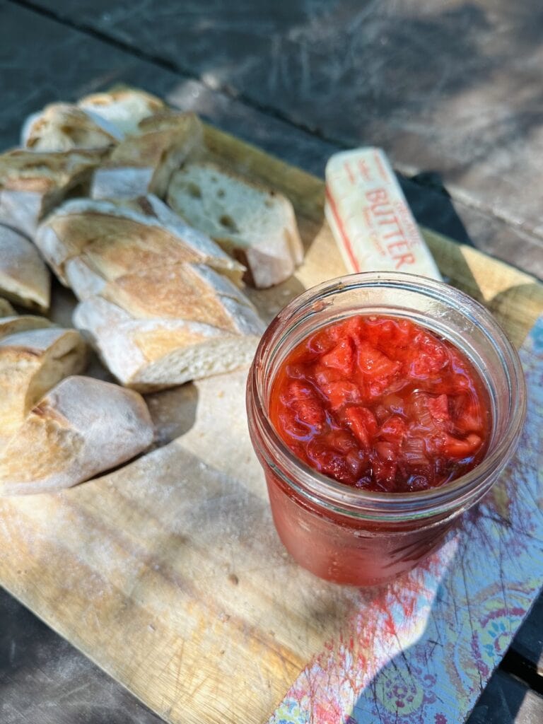 Bring strawberry rhubarb jam along on a camping trip and enjoy it in the morning with fresh bread and butter.