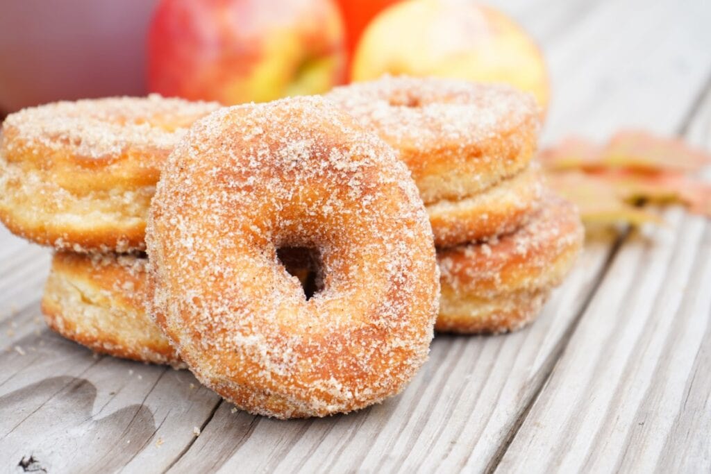 Donuts made with biscuit dough are an epic camping food idea for dessert. Dusted with sugar these are sure to bring smiles to everyone's faces.