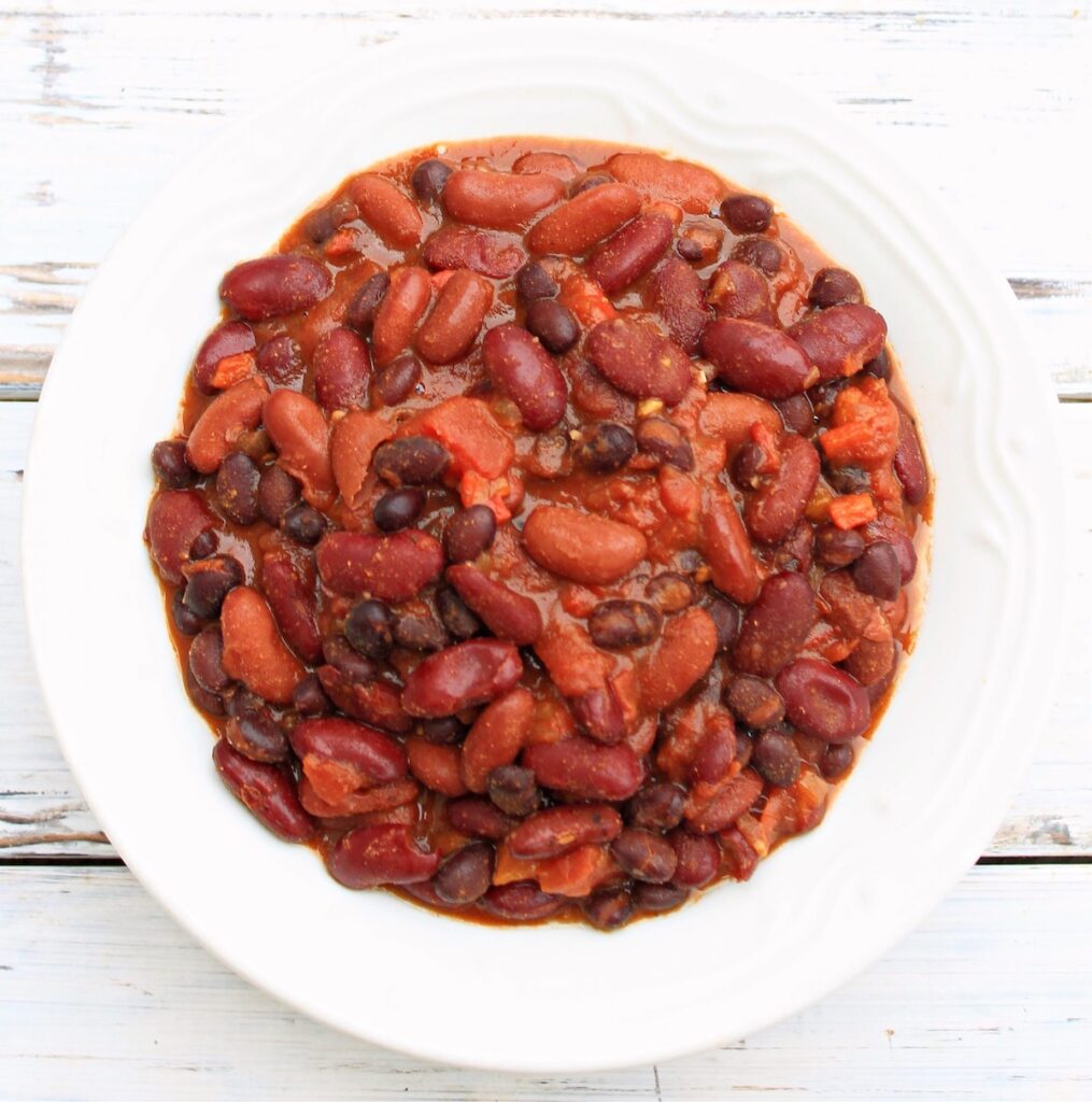 A beautiful bowl of three bean chili is a hearty yet healthy dinner for camping. Soups and chilis are great for camping food ideas when a chill hits the air.