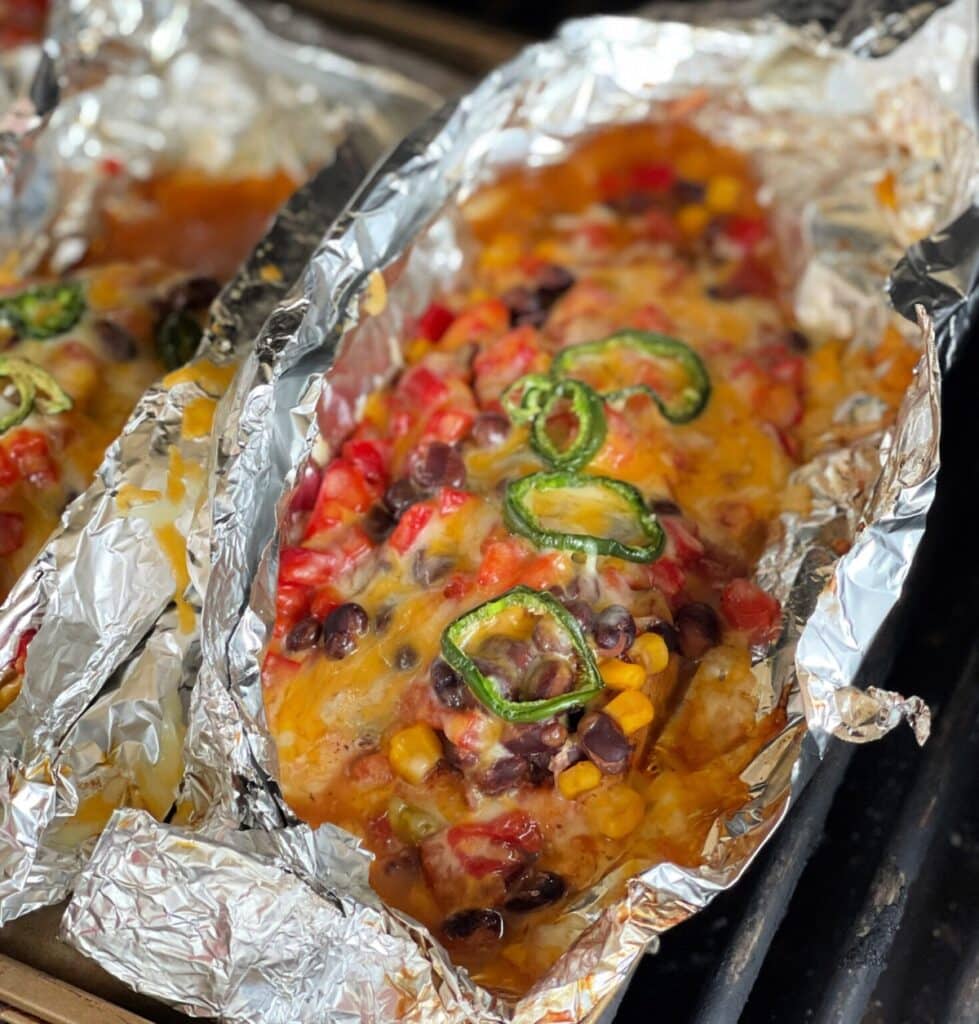 Fiesta chicken packets are full of cheesy goodness and have corn, black beans, and other yummy ingredients in them!
