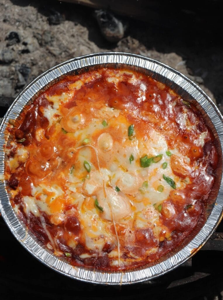 This melted cheese chili dip looks incredibly yummy and is definitely one of our favorite camping food ideas for lunch.