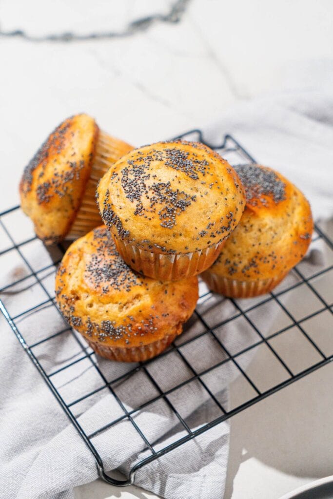 These golden cream cheese muffins topped with poppy seeds look too good to be true.