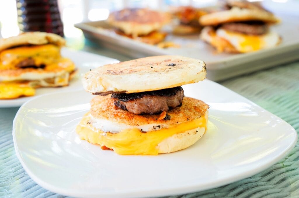 My mouth waters looking at these pancake wrapped egg sandwiches oozing with cheese complete with a breakfast sausage.