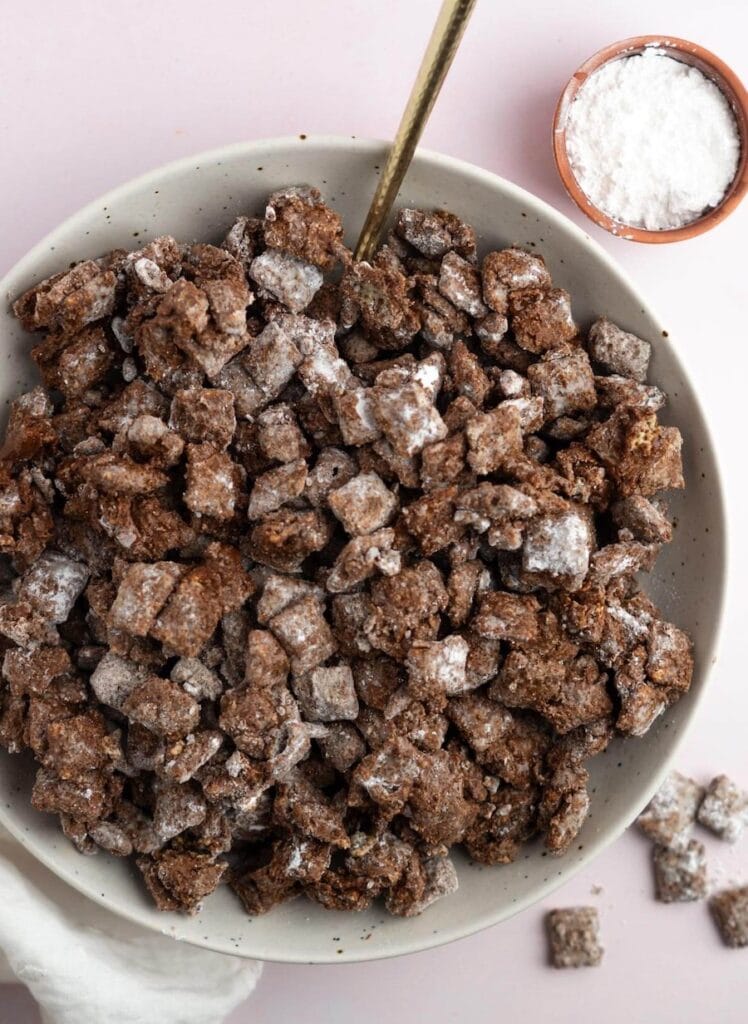 Puppy chow may not appear to be the most exciting snack in the world as it is all brown with a dusting of powdered sugar, but once you take a bite you will not be able to stop eating it!