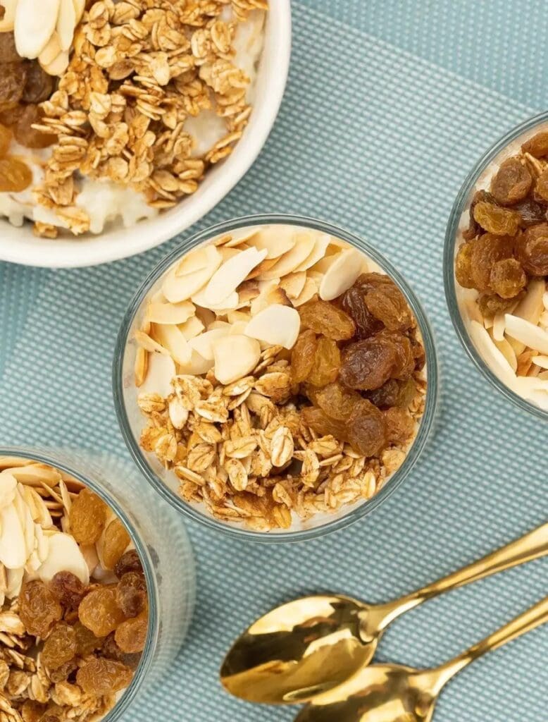 An irresistible bowl of creamy rice pudding topped with golden raisins, nuts and oats.