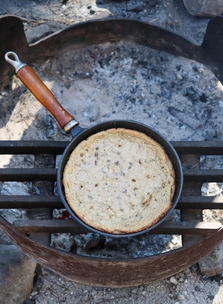 This truly is a giant cookie inside a pan that is cooked right on a grate over the campfire!